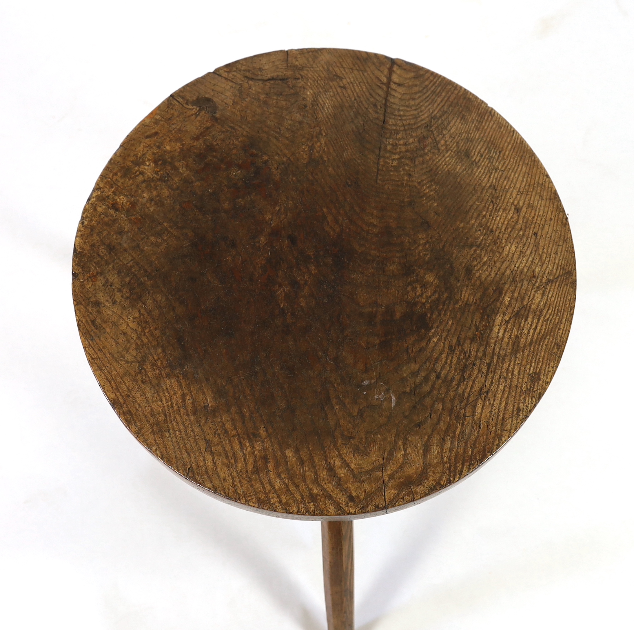 A 19th century circular ash cricket table, diameter 65cm, height 63cm